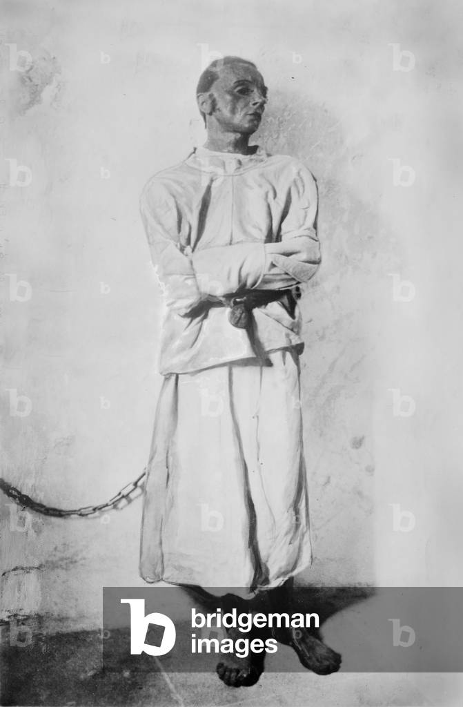 Portrait of a mentally insane man, original title: 'Maniac chained to a wall', from Fool's Tower (aka The Narrenturm), home for mental patients, Vienna, Austria, photograph c.1900-1920s