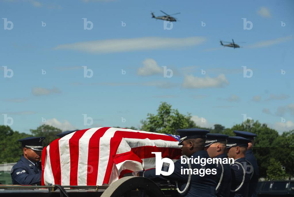 Funeral of US Air Force Capt. David A. Wisniewski who died July 2 2010 from injuries suffered during a helicopter crash in Afghanistan. He served four deployments to Iraq and three to Afghanistan. Helicopters fly over his internment at Arlington National Cemetery in Arlington