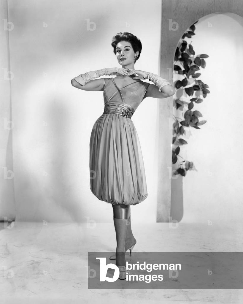 A woman modeling 1950s fashion, c.1956. Photo: