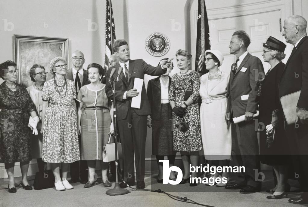 Older Peace Corps volunteers visit President John Kennedy at the White House. Aug. 30, 1962