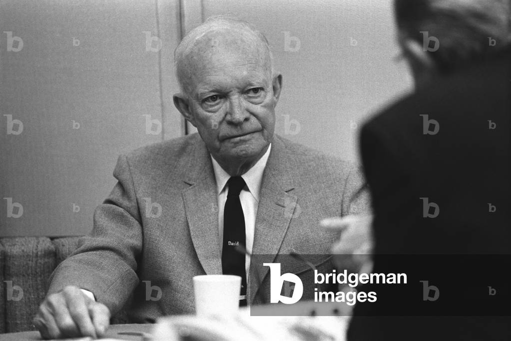 Former President Eisenhower listens to President Lyndon Johnson at a breakfast meeting aboard the parked Air Force One at March Air Force Base, in California. Johnson had just returned from a summit meeting with South Vietnamese leaders. April 18, 1968