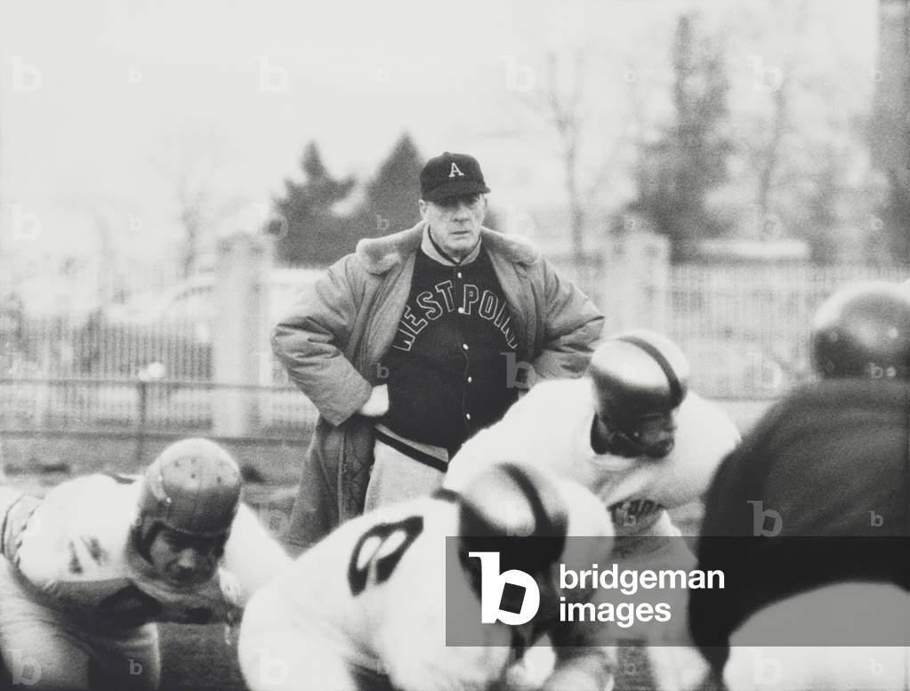Football coach Earl 'Red' Blaik, oversees his players as they practice. Nov. 28, 1956.
