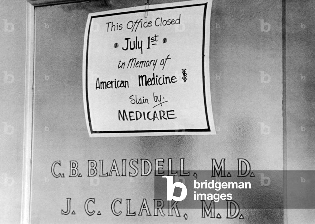 Doctor protesting the new Medicare program. The sign posted reads, 'This office Closed July 1st in memory of American Medicine, slain by Medicare'. Asbury Park, New Jersey. July 2, 1966