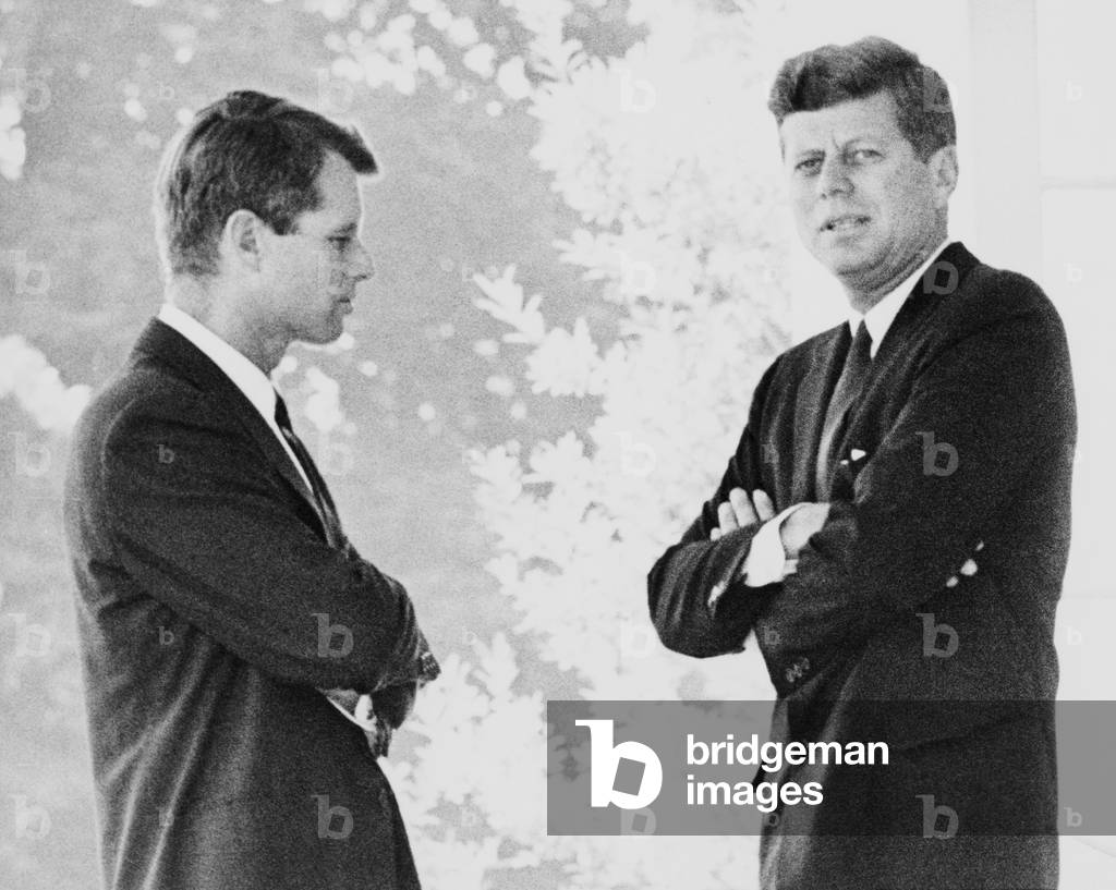 Brothers Robert F. and John F. Kennedy, portrait, standing on the White House portico. c. 1962