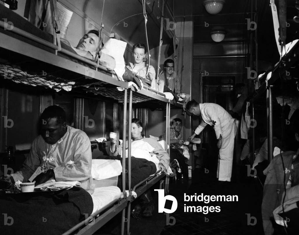 The wounded being cared for aboard the hospital train, December 8, 1943