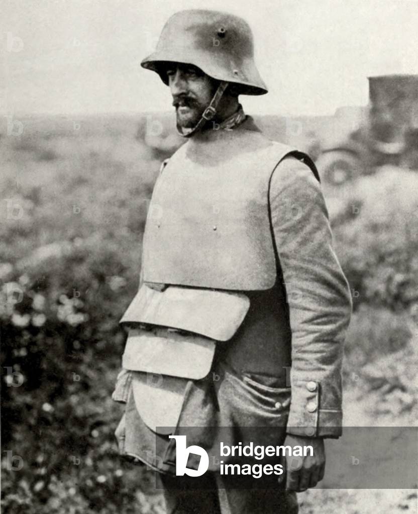 German soldier in metal helmet design of 1916 and old fashioned body armor. 1916-18