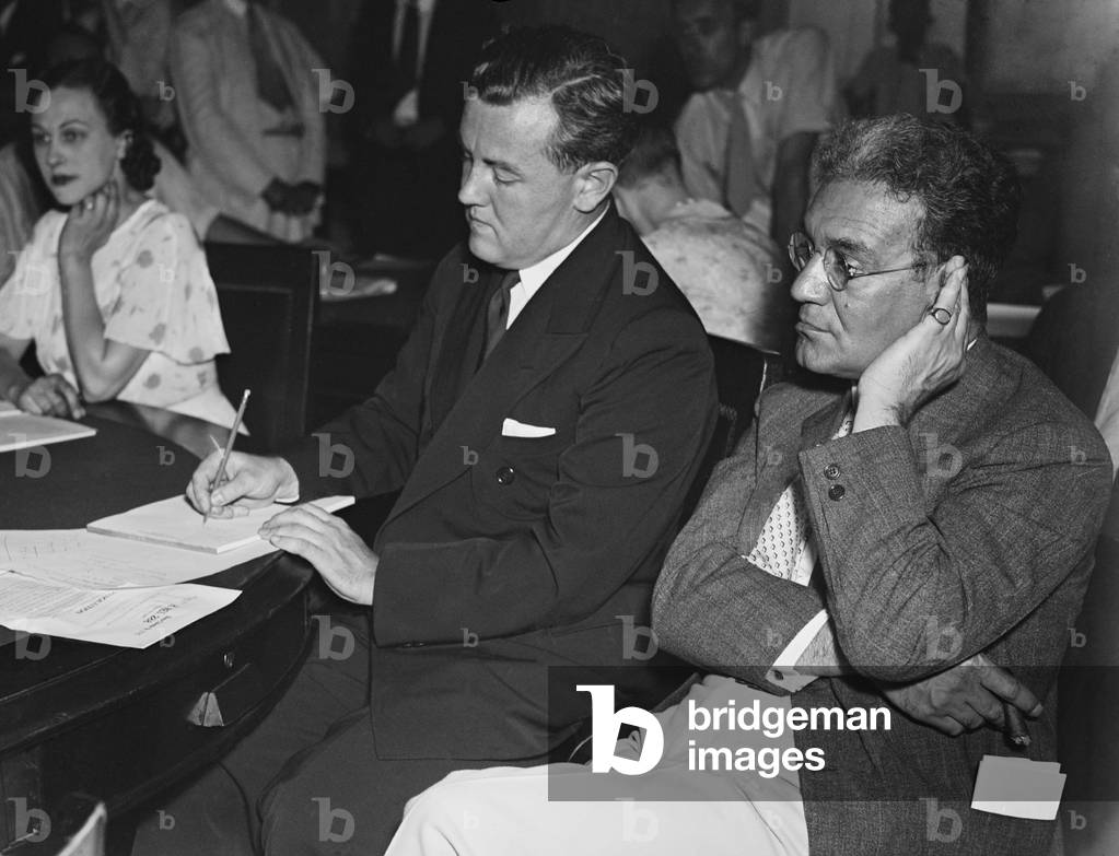 Thomas Corcoran (center) is grilled at a House rules investigation. July 9, 1935. Corcoran was under scrutiny for making rounds in the Capitol for feedback as he and Ben Cohen drafted legislation. At right is Judge Ferdinand Pecora of the N.Y. Supreme Court