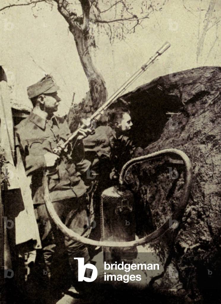 World War 1. Hungarians using an apparatus for projecting burning acids. c. 1916