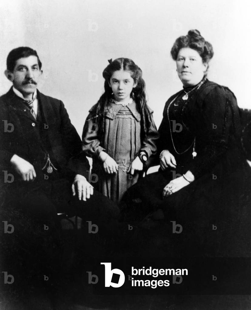 Eva Hart (ctr) was seven when she boarded the Titanic in 1912. Shown here with her parents. She escaped with her mother in a lifeboat. Her father perished in the tragedy, April 15, 1912
