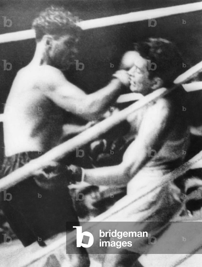 'Long Count Fight', the Gene Tunney-Jack Dempsey boxing match of Sept. 22, 1927. Jack Dempsey (dark trunks) batters Tunney against the ropes in the 7th round until he falls.