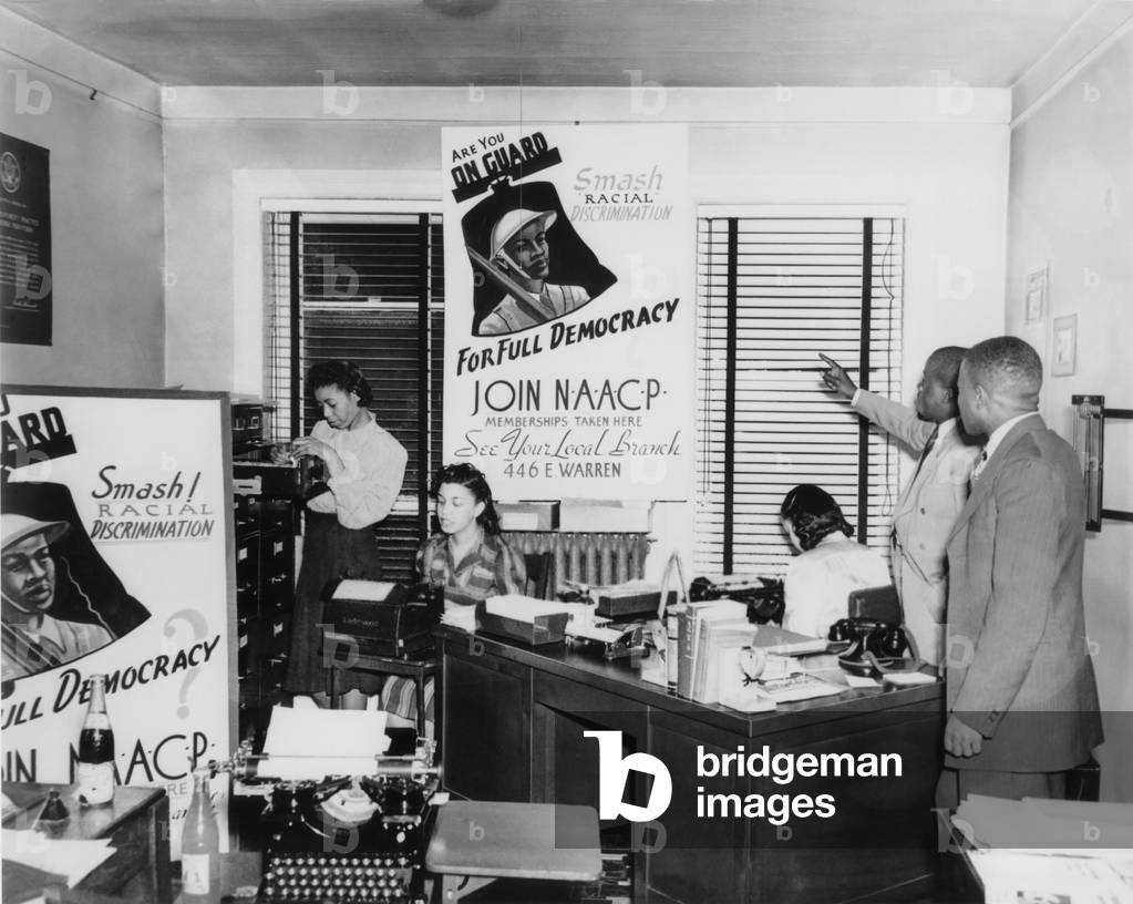 Interior view of NAACP branch office in Detroit, Michigan, showing NAACP membership drive posters picture an African American soldier. During World War II, African Americans spoke of a 'Double Victory,' one to win the war abroad and the second, for full civil rights at home