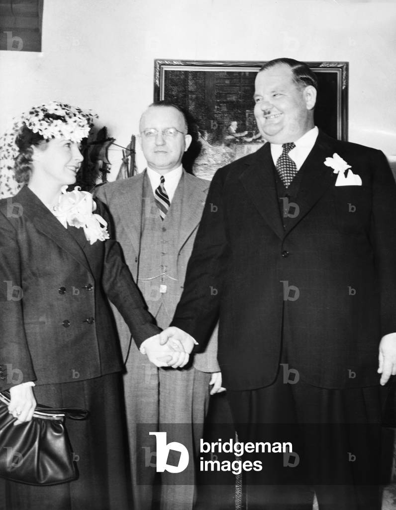 Comedian Oliver Hardy weds studio script girl, Virginia Lucille Jones, in Las Vegas, Nevada. Judge Roger Foley, (center) married them on March 8, 1940. They remained married until his death in 1957