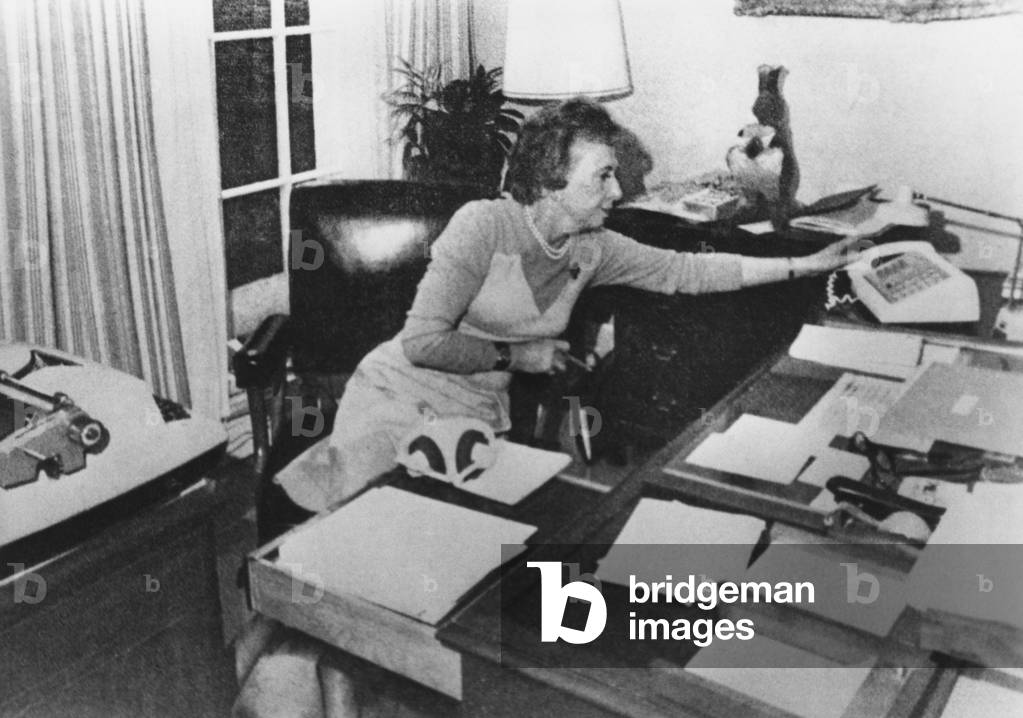 Rosemary Woods, President Nixon's personal secretary, demonstrating the 'Rose Mary Stretch'. She showed photographers how she may have caused the 18 1/2-minute gap in a crucial June 20, 1972 Watergate tape. c. Jan. 1974