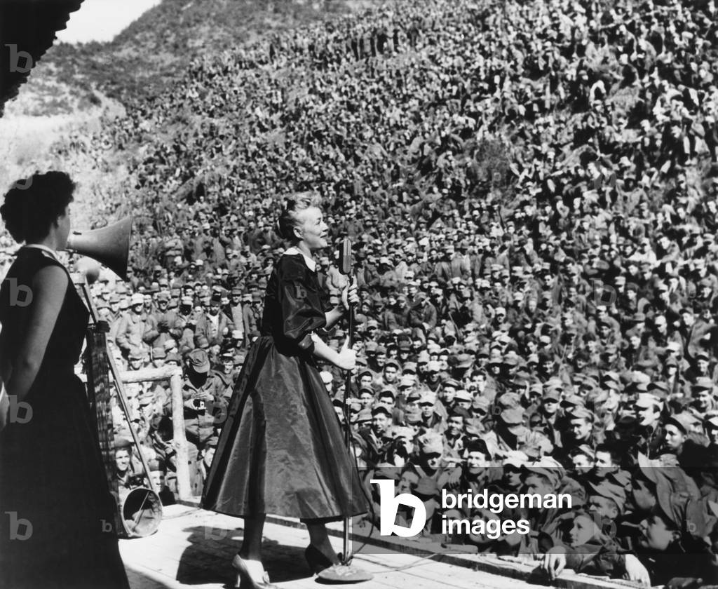 Movie star Betty Hutton entertaining Marines in Korea, March 9, 1952. First Division Marines fill the Montezuma Bowl only a few miles from the fighting front