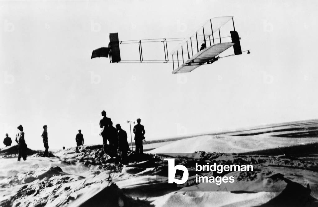 Orville Wright making a record breaking glider flight of 9 3/4 min., Kitty Hawk, N.C. October 24, 1911