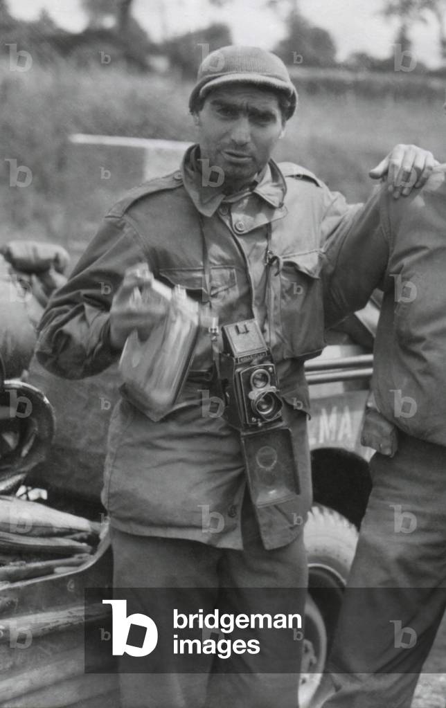 Robert Capa, in France while on assignment photographing for Life Magazine in World War 2 France. Mont Bocard, France. July 30, 1944