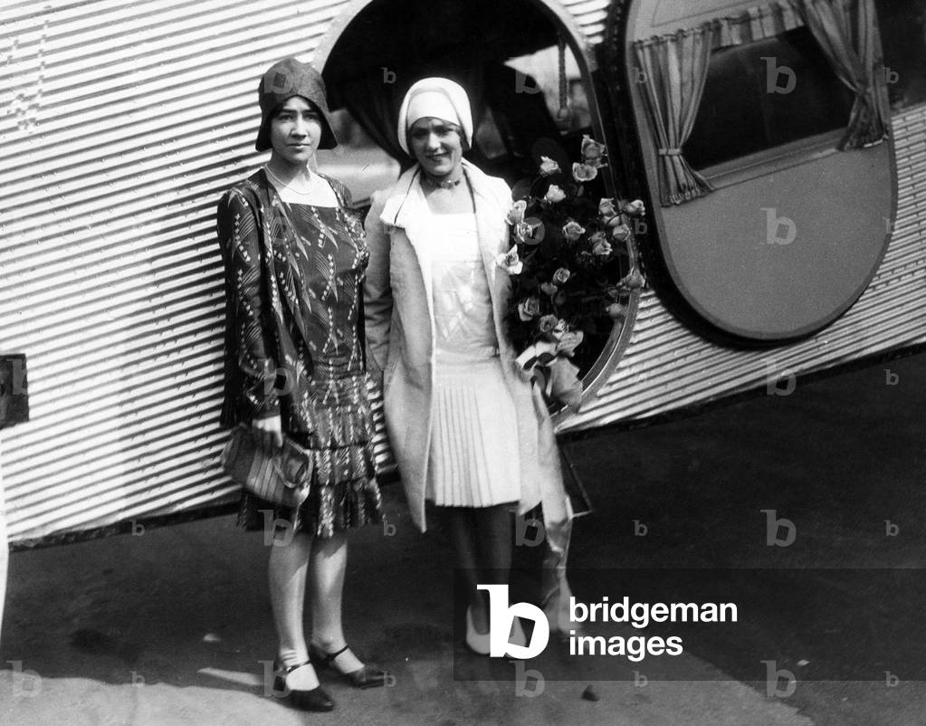 Anne Lindbergh and Mary Pickford taking part in the christening ceremonies of tri-motored plane to be flown by Charles Lindbergh, Los Angeles, California, 1929.