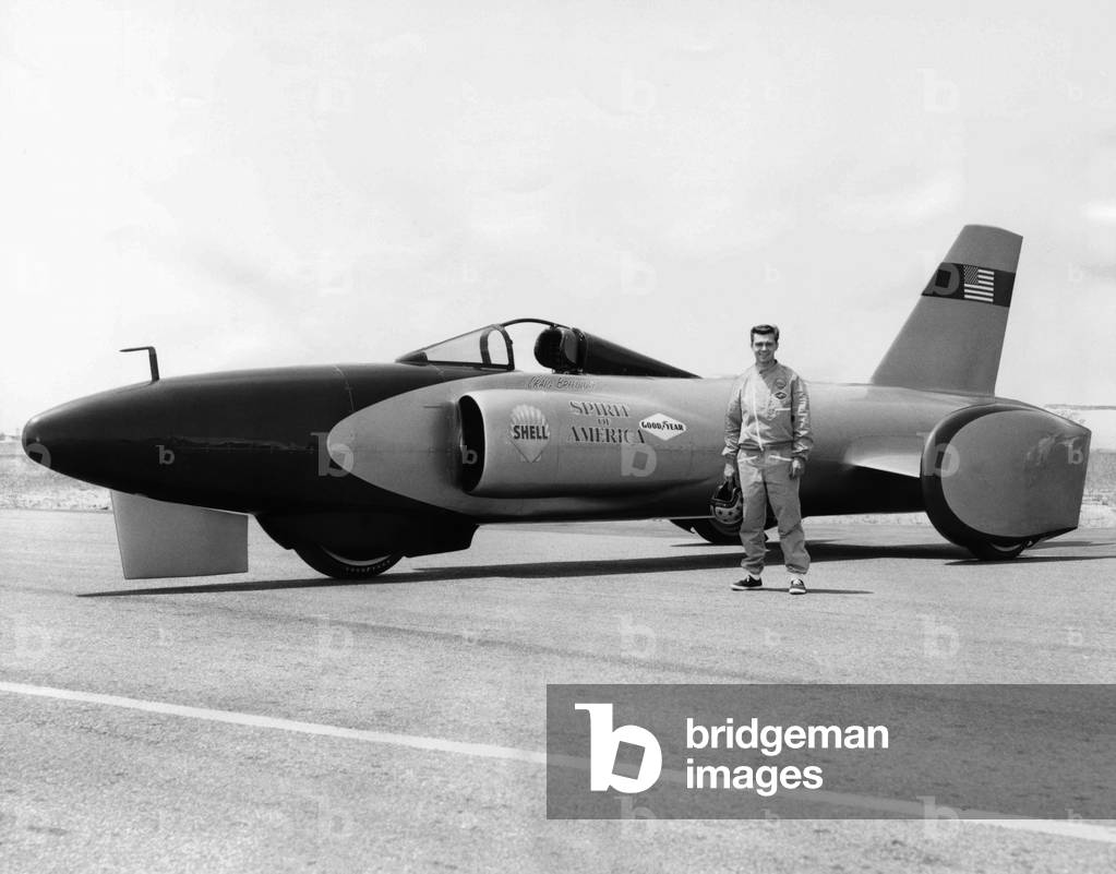 Craig Breedlove stands beside his jet car 'Spirit of America' on the Bonneville Salt Flats in Utah. July 25, 1963. Breedlove set a new land speed record of reached 407.45 mph on Aug. 5, 1963