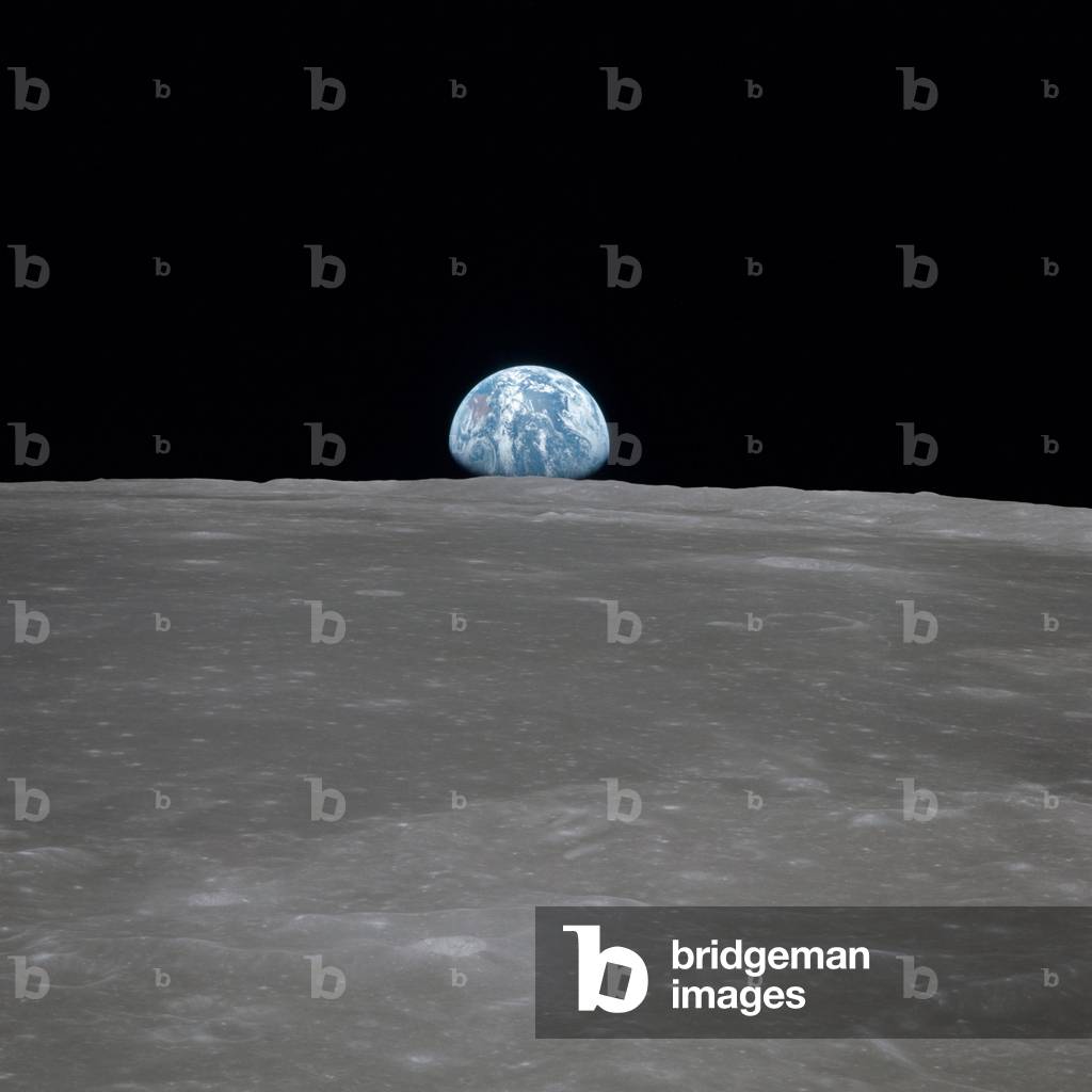 Apollo 11 Earth rise over the Moon. Earth on the horizon in the Mare Smythii Region of the Moon. Image 3 of a NASA sequence of 18. July 20, 1969