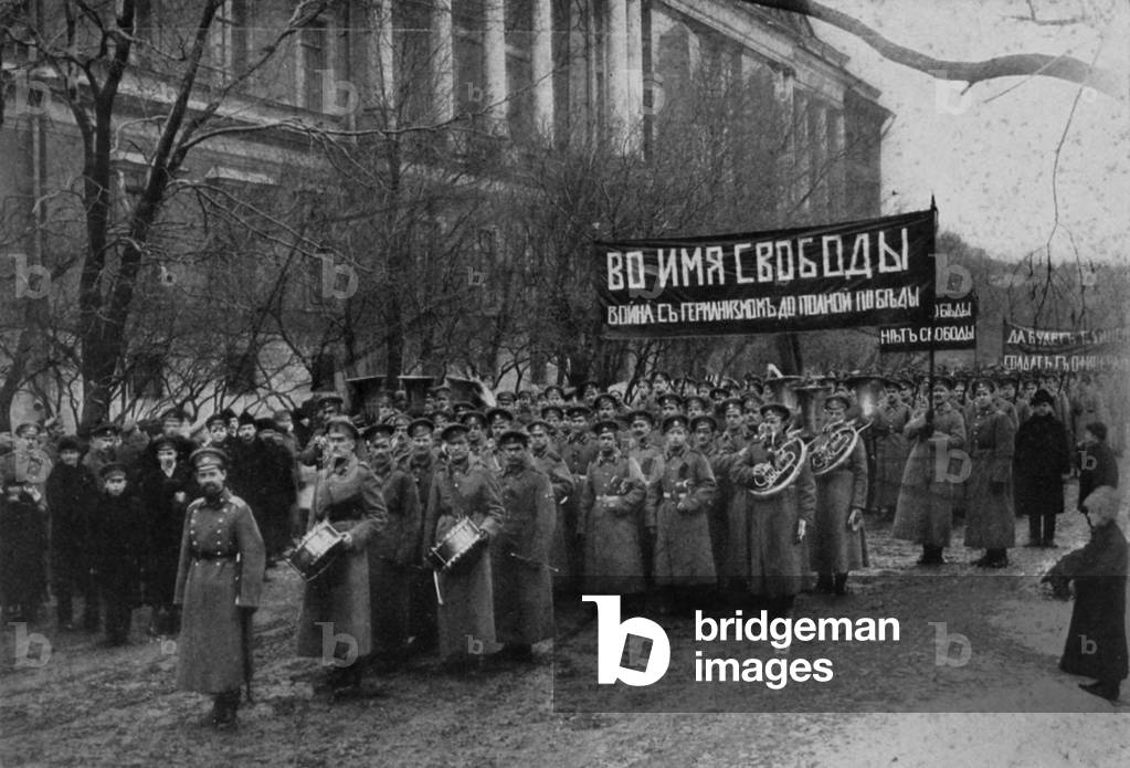 Russian Revolutionary troops demonstrate in front of Engineers Palace. April 1, 1917. Their sign translates 'In The Name of Liberty, War Against Germanism to Full Victory.' These were troops loyal to the Provisional Government headed by Kerensky, and the 'Germans' refers to their rivals, the Lenin lead Bolsheviks. St. Petersberg