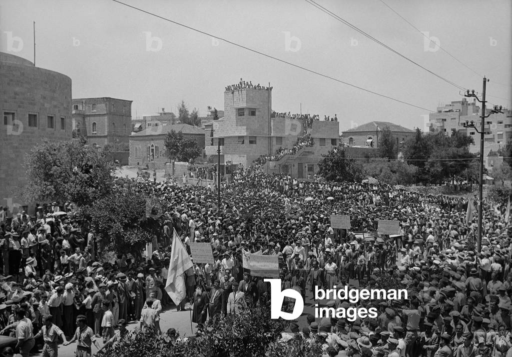 Jewish protest against Palestine White Paper, May 18, 1939. Procession outside the Yeshurun Synagogue on King George Ave., Jerusalem. The policy paper issued by the British government proposed an independent Palestine governed by Palestinian Arabs and Jews in proportion to their numbers in the population