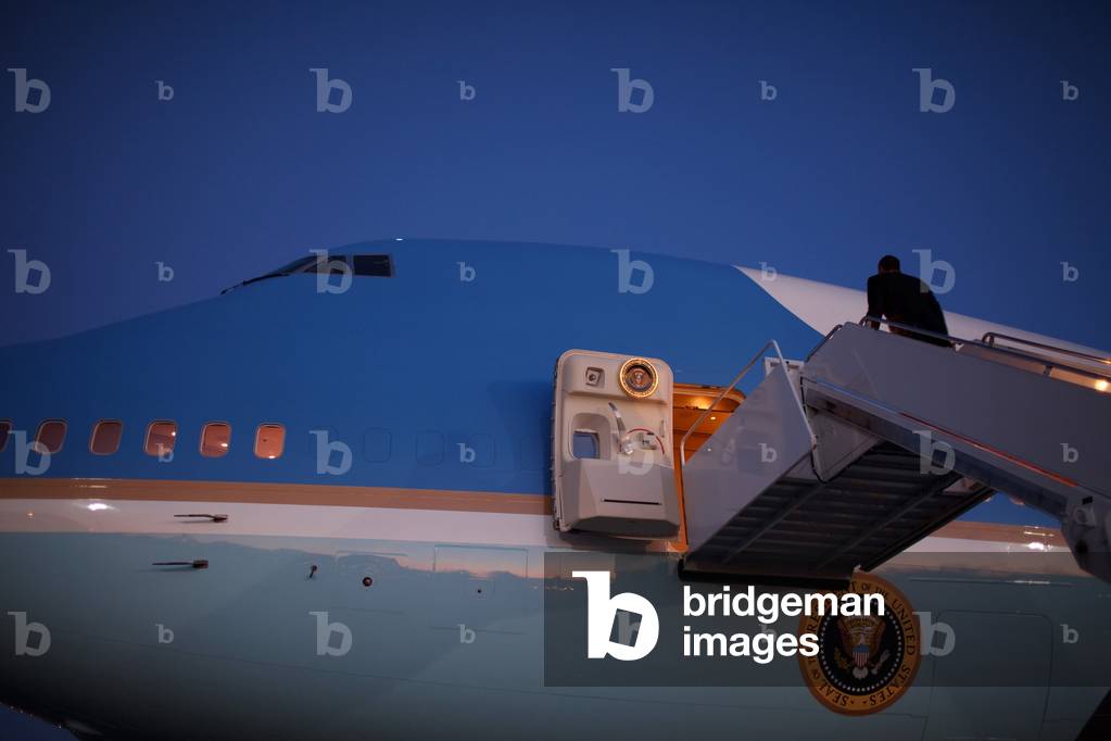 President Obama walks up the stairs of before his first trip on Air Force One Feb. 5 2009. He traveled from Andrews Air Force Base to Newport News Virginia. Feb. 5 2009. (BSWH_2011_8_123)