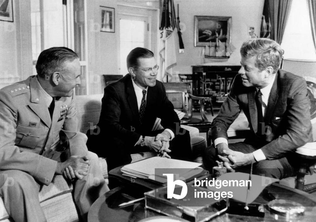 Defense Secretary Robert McNamara (center), meeting with President John F. Kennedy (far right), in the White House to give him an appraisal of the situation in South Vietnam, October 2, 1963.