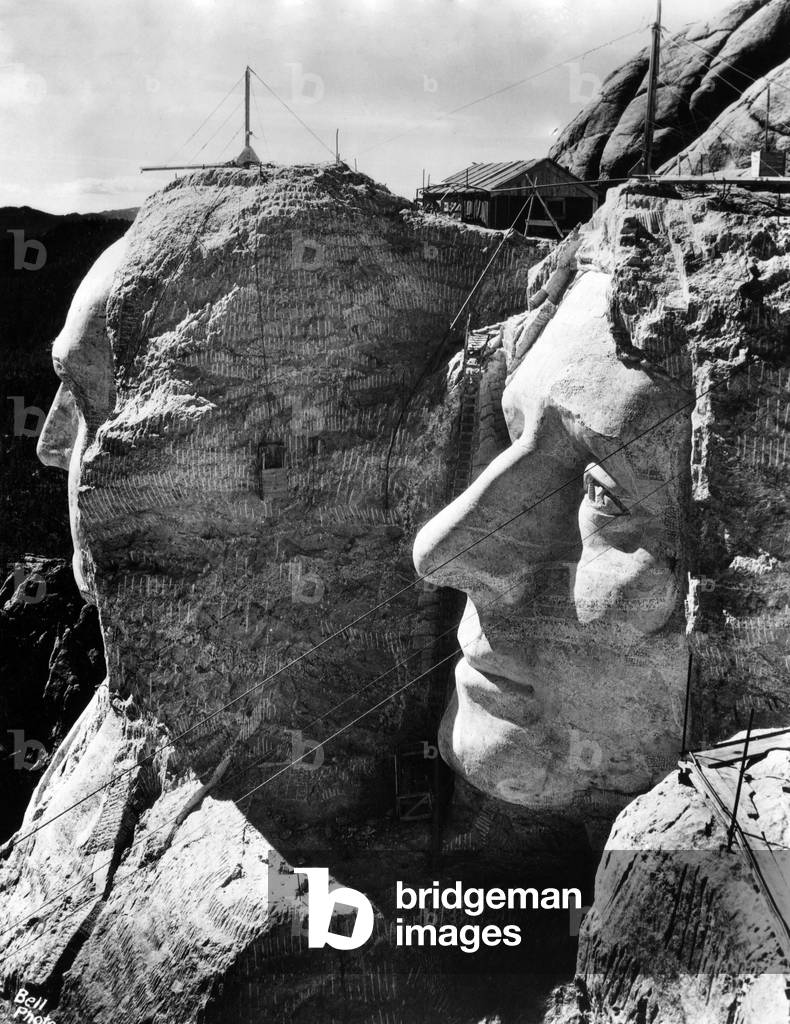 MOUNT RUSHMORE, operations to resume in April after halting for winter. View shows completed profiles of George Washington (l) and Thomas Jefferson (r), South Dakota Black Hills, March 26, 1937