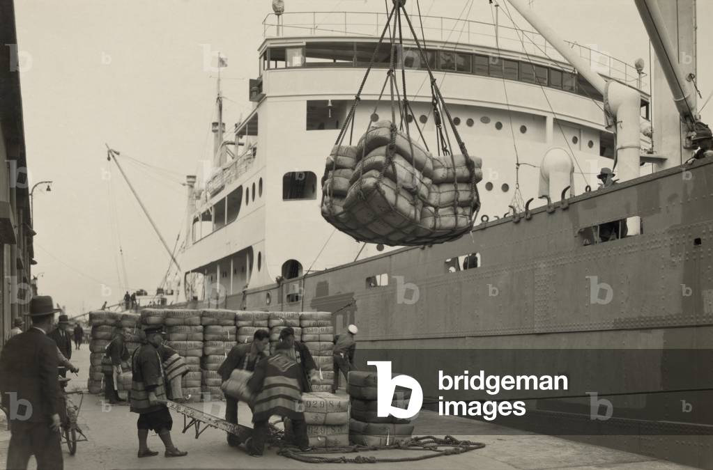 Japanese longshoremen loading bundles of raw silk onto a freighter. c. 1938 LC-DIG-ppmsca-13472
