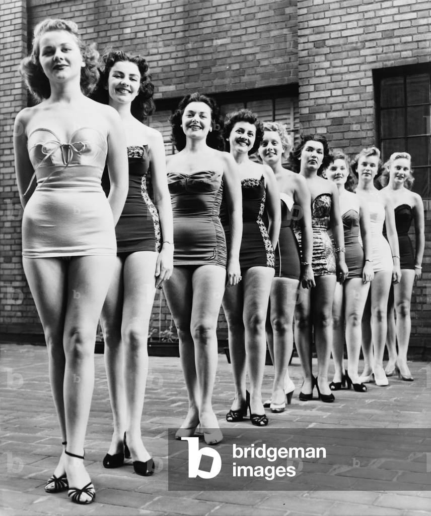 Miss New York City beauty contestants line up atop a city hotel in 1952