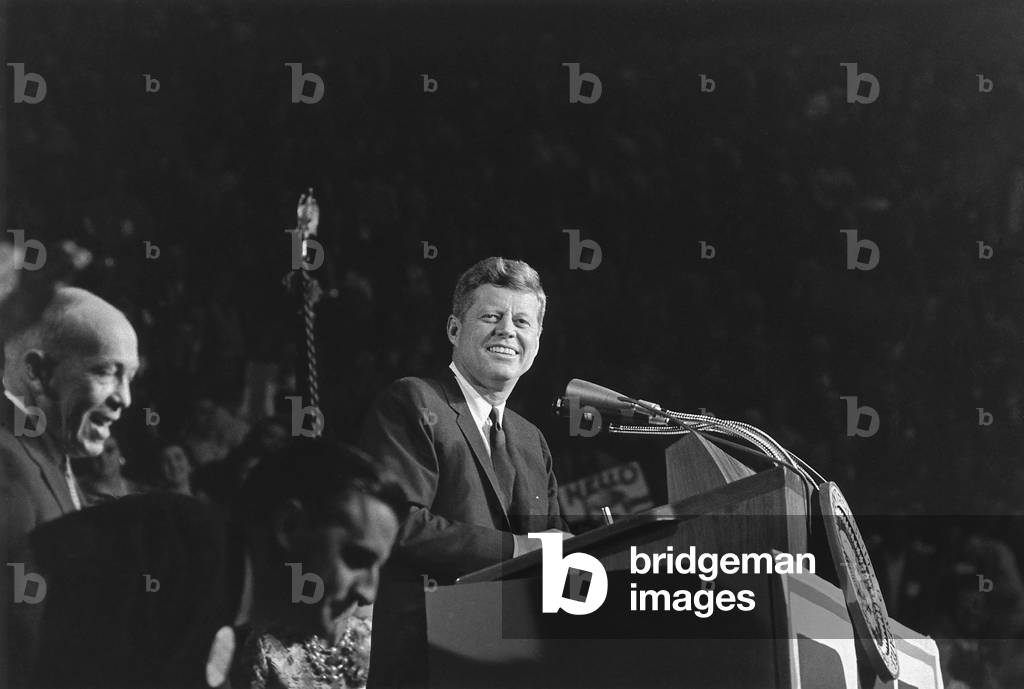 President Kennedy speaks at 'Bean Feed' on Oct. 6, 1962. Minnesota's 'Democratic-Farmer-Labor party'(DFL) held 'Bean Feed' gatherings across the state where voter could meet politicians. At lower left is future Vice President, the Minnesota Attorney General, Walter Mondale