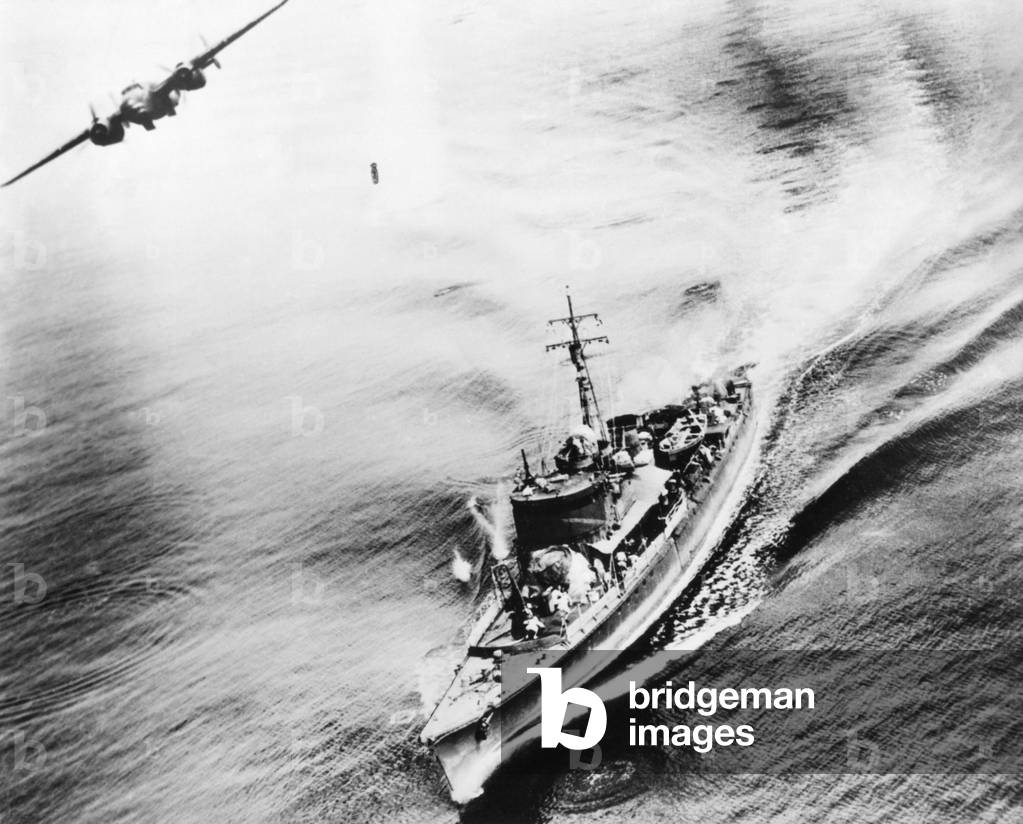 Small Japanese war vessel bombed by U.S. B-25 bomber in the Bismarck Sea, March 21, 1944. The ships crew can be seen running for cover. The ship was sunk by the attack near New Ireland. World War 2