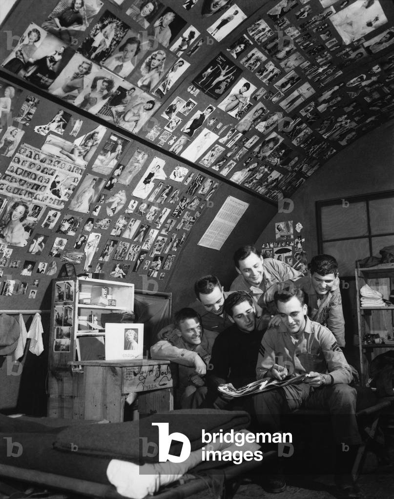 U.S. Marine fighter pilots of the 'Devil Cats' Squadron with nearly 3,000 pin-ups. Their Quonset hut wallpaper includes over 200 pictures of Marilyn Monroe. Oct. 28, 1952. Korean War, 1950-53
