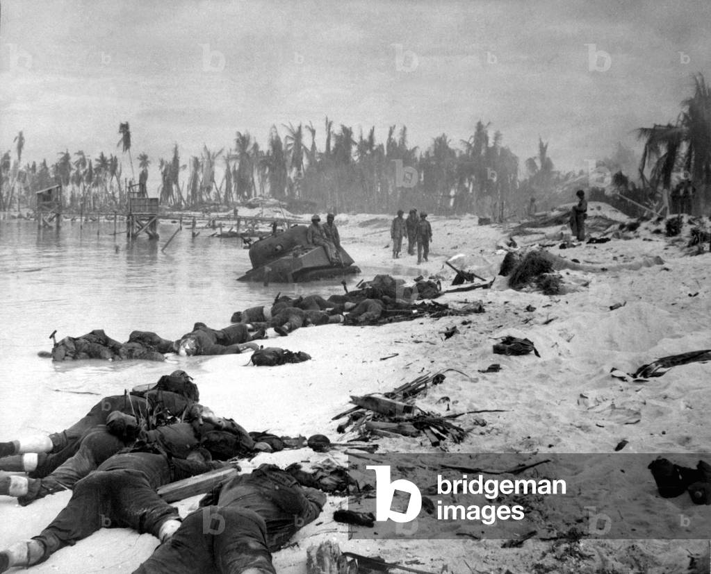 Sprawled bodies on beach of Tarawa Island, Gilbert Islands. In the U.S. invasion 990 U.S. Marines were killed, while 5000 Japanese defenders died, with only 17 surrendering. Nov. 19-23, 1943