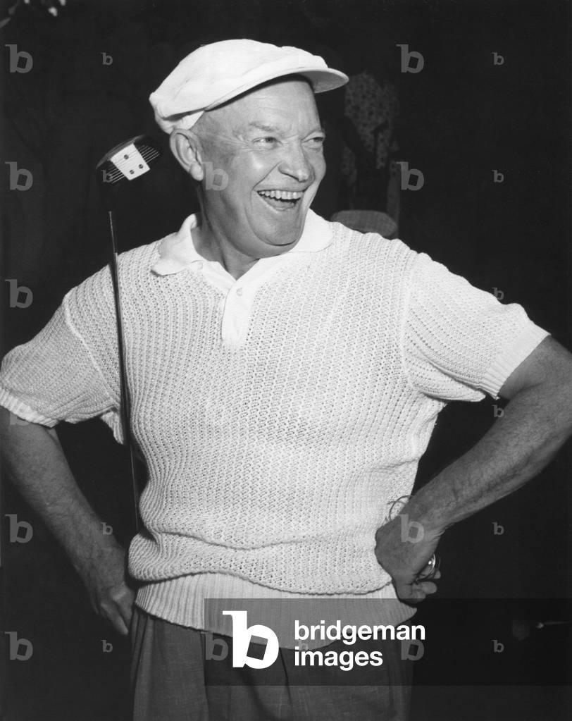 President Dwight Eisenhower smiling while golfing. c. 1954.