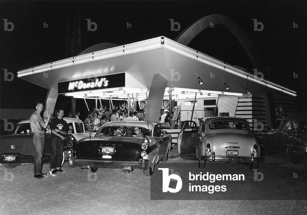 Customers at a the first McDonald's restaurant opened by Ray Kroc in Des Plaines Illinois near Chicago on April 15 1955 the same day that Kroc incorporated his company as McDonald's Systems Inc. later renamed McDonald's Corporation in 1960 . McDonal, Photo by:Everett Collection