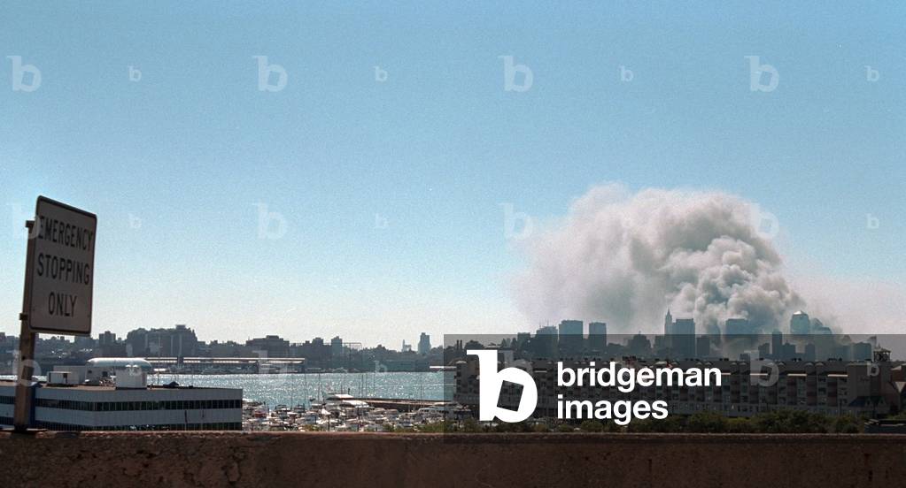 Smoke and pulverized building debris rise from the World Trade Center, Tuesday, Sept. 11, 2001. Photo taken from New Jersey after the North Tower collapsed at 10:28 AM. New York City, Sept. 11, 2001