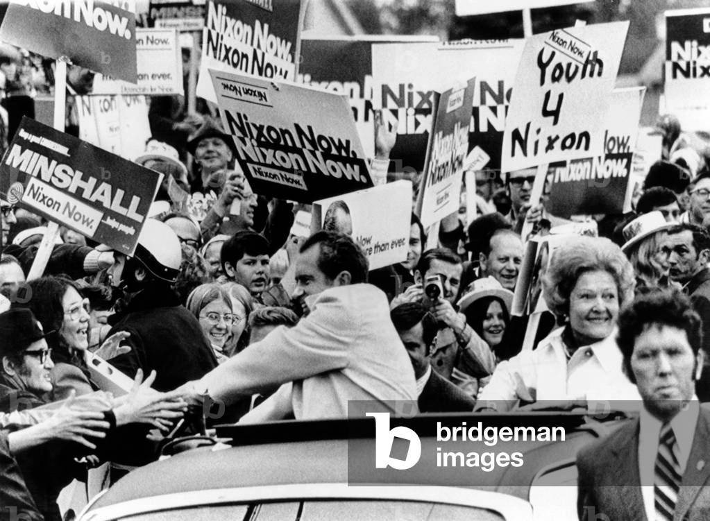 President Richard Nixon shakes hands with bystanders on his 80-mile motorcade campaign swing through Northeast Ohio. Oct. 28, 1972
