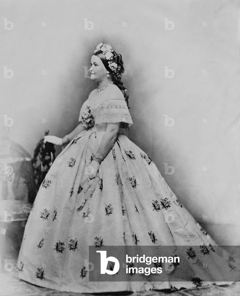 Mary Todd Lincoln (1818-1882), as First Lady, in embroidered ball gown with flowers in her hair. Photography by Brady