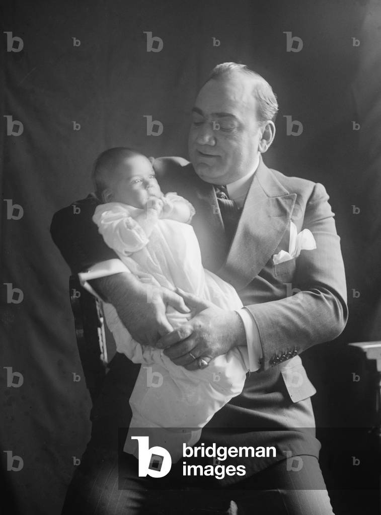 Enrico Caruso (1873-1921), holding his baby daughter, Gloria. 1919