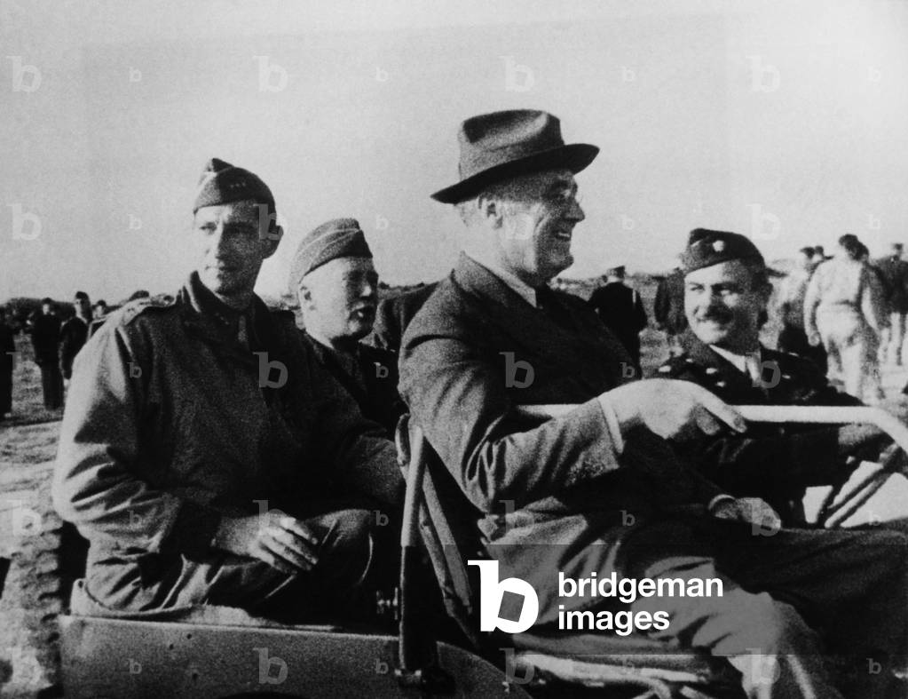 President Franklin D. Roosevelt (front right), at an army base in Sicily, l-r, from left: Lieutenant General Mark W. Clark, Lieutenant General George S. Patton Jr., Roosevelt, July 12, 1938