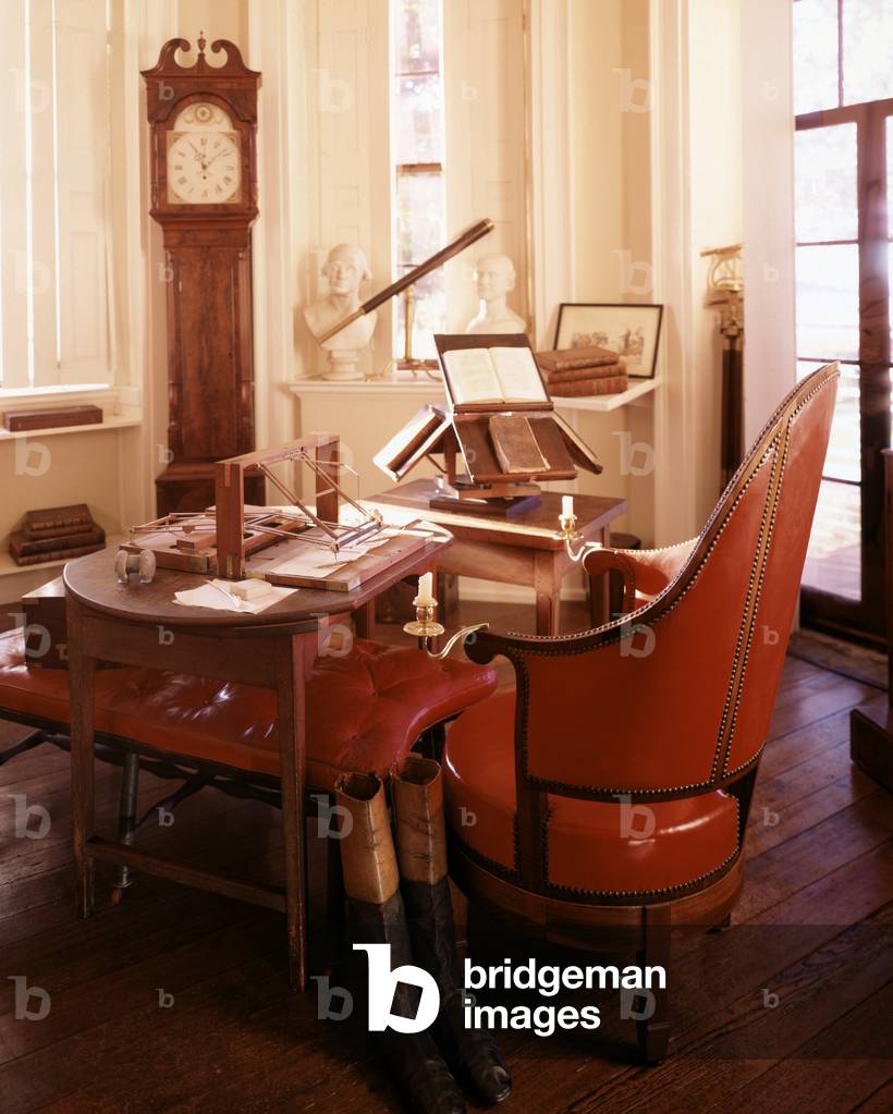 Monticello, the home built by Thomas Jefferson in the 1770s. Jefferson's desk with his invention to create duplicates of his correspondence. Also there is a book stand, grandfather clock, and telescope. c. 1990