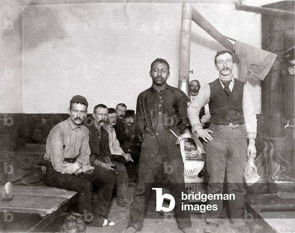 Homeless men at the police station lodging, in New York City. The facilities were disease ridden places where the strong preyed on the weak. This location was spreading typhus. Jacob Riis photo, c. 1895