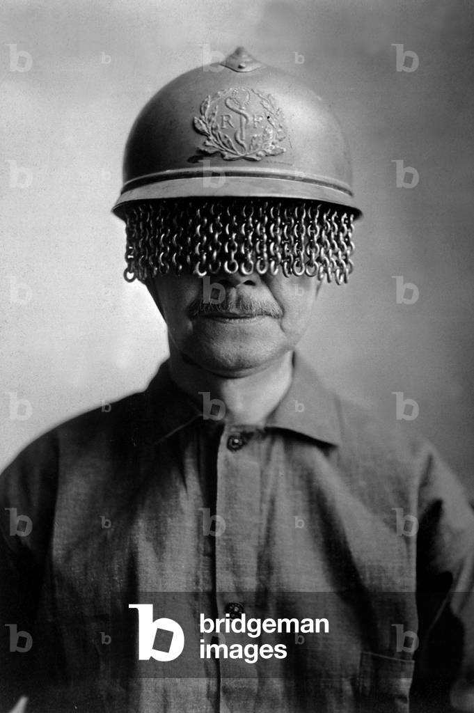 Chain screens on steel helmet to protect World War I soldiers' eyes from fragments of shell, rock, etc. It was manufactured by E. J. Codd Co., Baltimore, Md. c. 1918