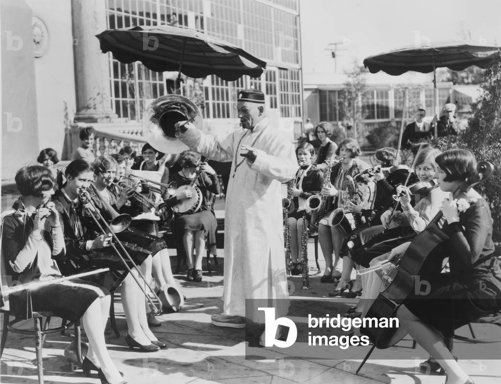 Lon Chaney, as Mr. Wu, conducts All-girl's band that suppli es music for MR WU film. 1927. es music for MR WU film. 1927. es music for MR WU film. 1927