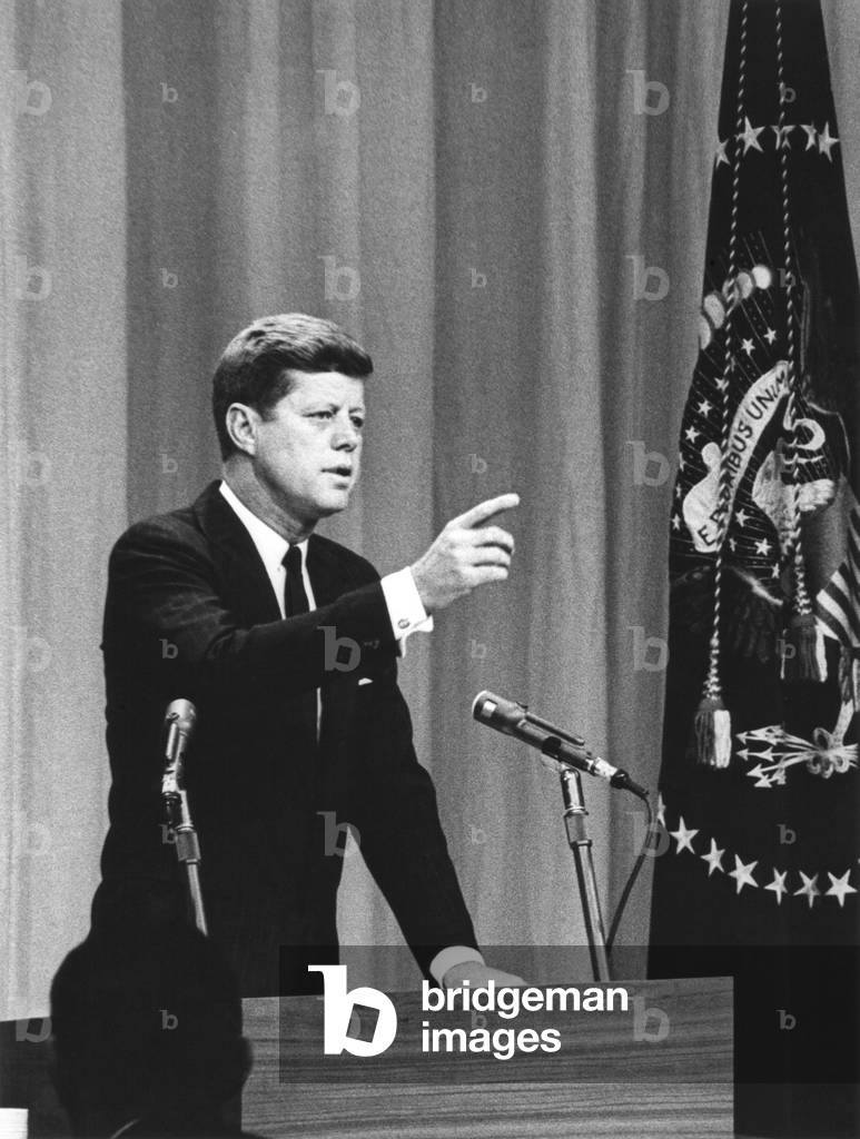President John Kennedy calls for a question during the first press conference. Jan 25, 1961. It was the first presidential press conference to be televised live.