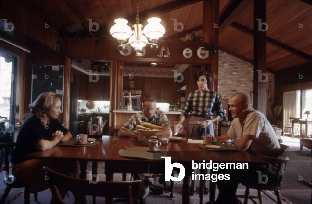 Mercury Astronauts Scott Carpenter (center) and John Glenn (far right) with their wives Annie Glenn (next to John) and Rene Carpenter (far left) at the Glenn's house, Ohio, 1965
