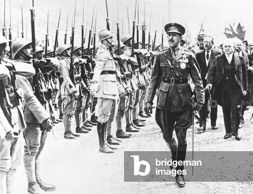 Alfonso VIII, King of Spain, reviewing French Troops, July 1928. Behind him at left is French Prime Minister Gaston Doumergue at Forges d'Abel, on the border of France and Spain, to celebrate the opening of a new railway over the Pyrenees linking Pau and Saragossa