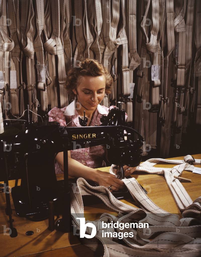 Woman war worker stitching harnesses at the Pioneer Parachute Company Mills. During World War 2, in Manchester, Conn. July 1942