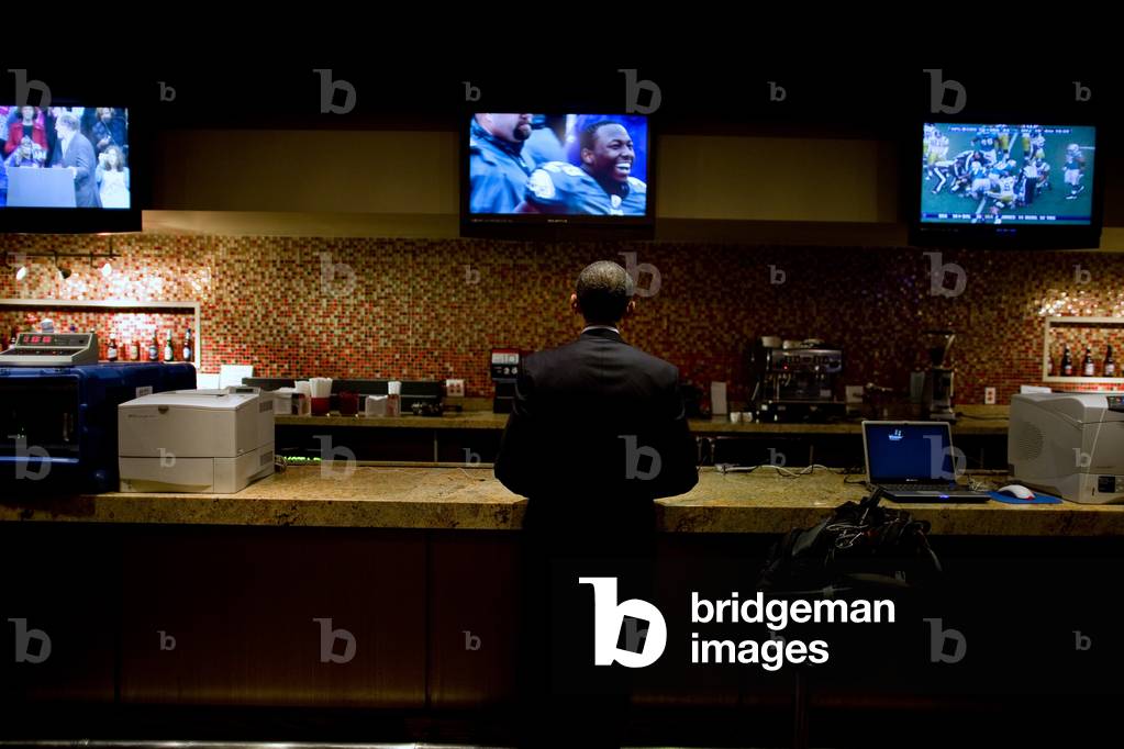 President Barack Obama watches a televised football game in a holding room before a campaign rally at the Prudential Center in Newark N.J. Nov. 1 2009.,